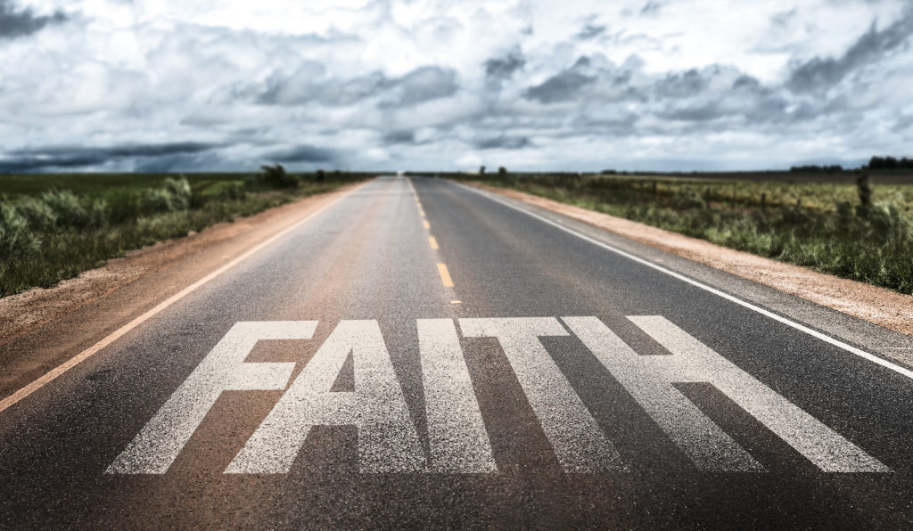 Faith written on rural road
